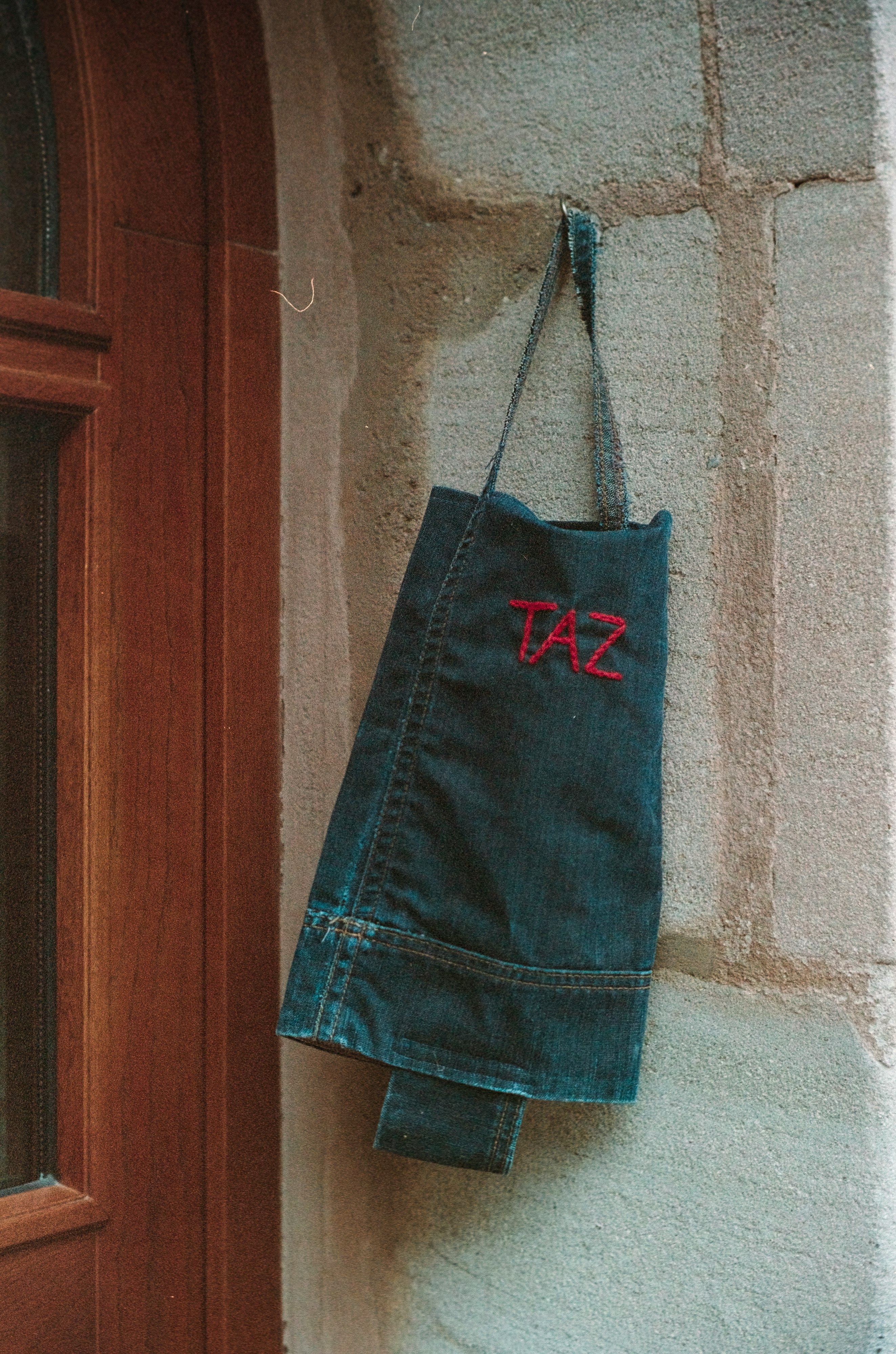 blue denim skirt hanged on black clothes hanger